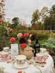 Outdoor table setting with block printed napkins and flowers