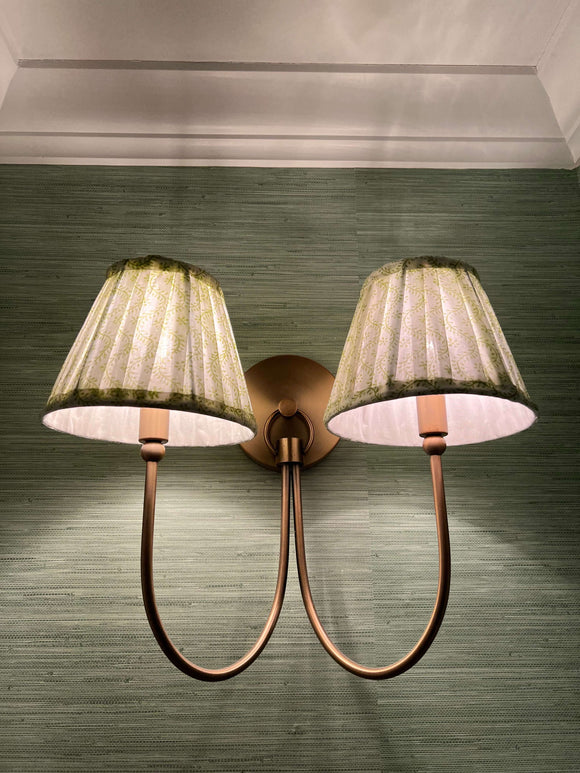 Honeysuckle Sconce Shade | Need an instant room upgrade? Our hand-printed, hand pleated lampshades bring a soft glow and touch of patterned interest to any living space. Plain shades be gone! How many can we have in one room? Empire style with clip fittin