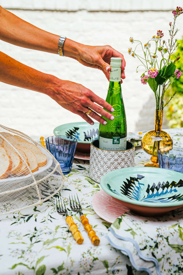 Inslee Claiborne Linen Tablecloth | The Claiborne linen block print tablecloth features Inslee Fariss’s hand-painted blue blossoms and vines on crisp white—effortless, elegant, and summer-ready.