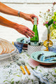 Inslee Claiborne Linen Tablecloth | The Claiborne linen block print tablecloth features Inslee Fariss’s hand-painted blue blossoms and vines on crisp white—effortless, elegant, and summer-ready.