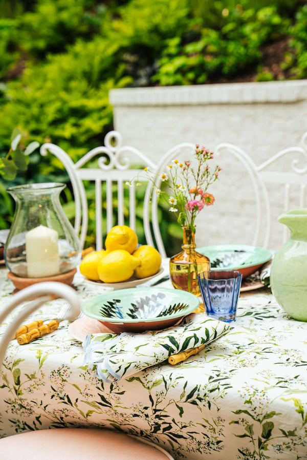 Inslee Claiborne Linen Tablecloth | The Claiborne linen block print tablecloth features Inslee Fariss’s hand-painted blue blossoms and vines on crisp white—effortless, elegant, and summer-ready.