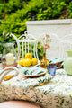 Inslee Claiborne Linen Tablecloth | The Claiborne linen block print tablecloth features Inslee Fariss’s hand-painted blue blossoms and vines on crisp white—effortless, elegant, and summer-ready.