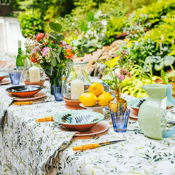 Inslee Claiborne Linen Tablecloth | The Claiborne linen block print tablecloth features Inslee Fariss’s hand-painted blue blossoms and vines on crisp white—effortless, elegant, and summer-ready.