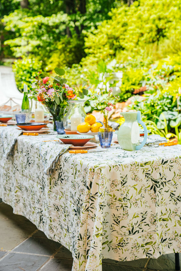 Inslee Claiborne Linen Tablecloth | The Claiborne linen block print tablecloth features Inslee Fariss’s hand-painted blue blossoms and vines on crisp white—effortless, elegant, and summer-ready.