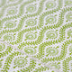 Close up of green block printed tablecloth fabric