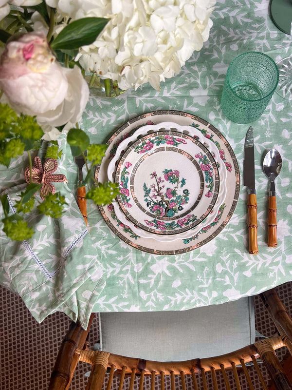 Camellia Tablecloth | Our Camellia print is a crowd-pleasing, grounded base upon which you can build any table scheme. With a calming ocean blue background and contrasting pale blue outlines, this tangle of vines adds sophistication and season-less warmth