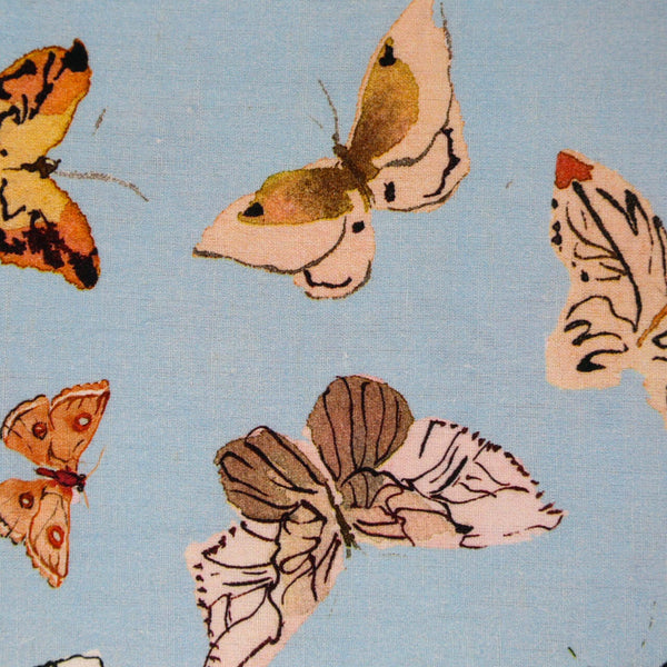 Inslee Persephone Linen Tablecloth | The Persephone linen block print tablecloth features Inslee Fariss’s watercolor butterflies on soft blue—elegant, airy, and perfect for relaxed gatherings.