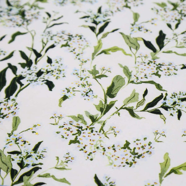 Inslee Claiborne Linen Tablecloth | The Claiborne linen block print tablecloth features Inslee Fariss’s hand-painted blue blossoms and vines on crisp white—effortless, elegant, and summer-ready.