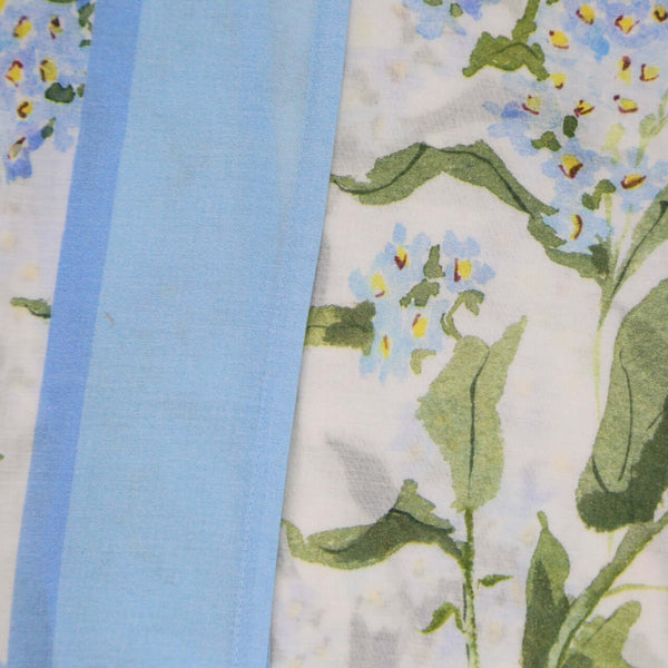 Inslee Claiborne Pareo | From our Inslee Fariss collab, the Claiborne block print sarong pareo features soft blue blooms on cotton voile—light, flattering, and beach-day ready.