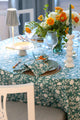 Camellia Tablecloth | Our Camellia print is a crowd-pleasing, grounded base upon which you can build any table scheme. With a calming ocean blue background and contrasting pale blue outlines, this tangle of vines adds sophistication and season-less warmth