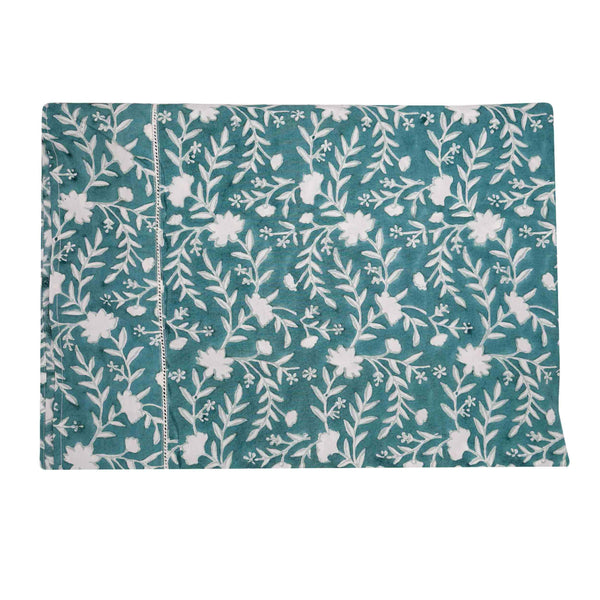 Camellia Tablecloth | Our Camellia print is a crowd-pleasing, grounded base upon which you can build any table scheme. With a calming ocean blue background and contrasting pale blue outlines, this tangle of vines adds sophistication and season-less warmth