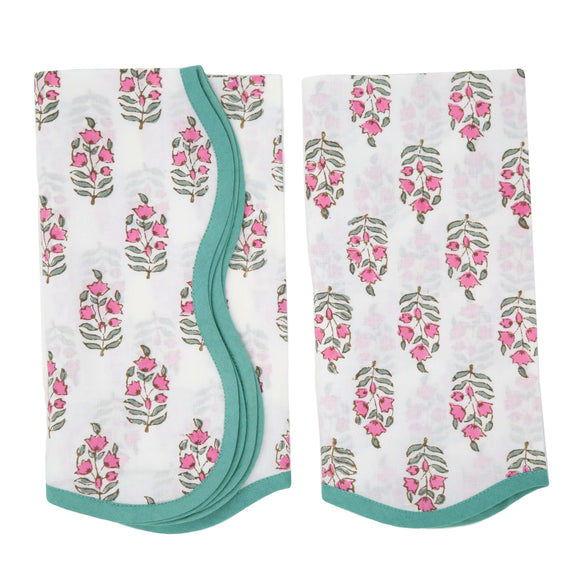 Set of pink and white block printed napkins with green piping