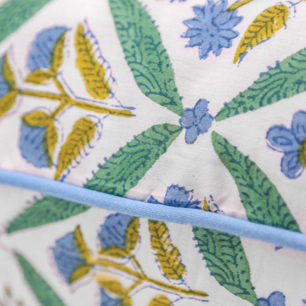 Green and blue block printed pillow cover with blue piping