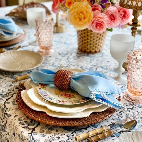 Blue linen cloth napkins on a set dining room table