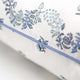 Close up of blue piping on block printed pillow cover