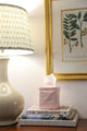 Pink striped block printed tissue box cover on table