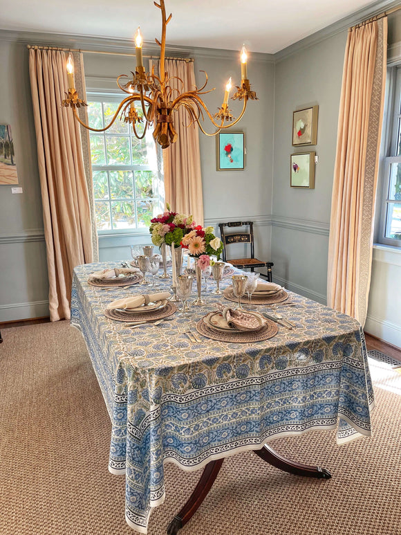 Dining room table set with a blue block printed tablecloth