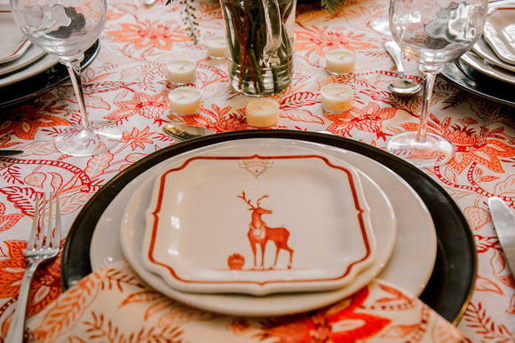 Christmas china on a red block printed tablecloth