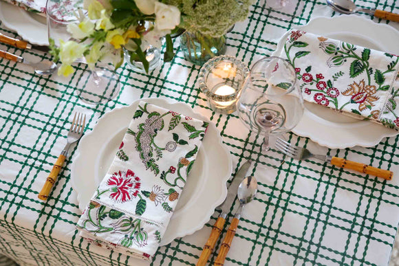 Pink and green tablecloth and flowers