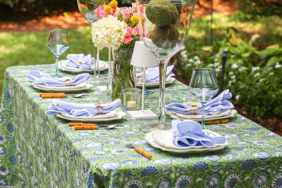 Outdoor table set with green block printed tablecloth