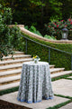 Cocktail table outside with blue block printed tablecloth