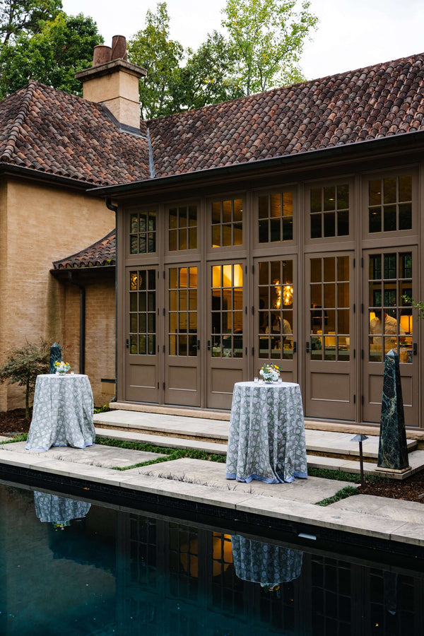 Cocktail tables outside with blue block printed tablecloth