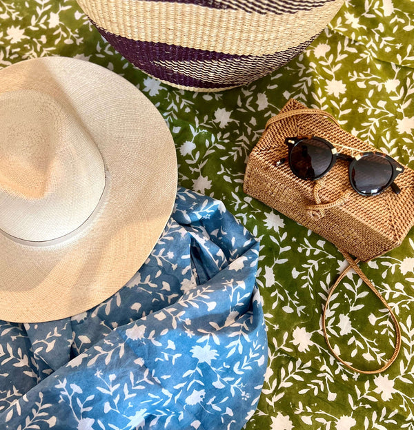 Womens hat and sunglasses on green and blue block printed swimsuit cover up