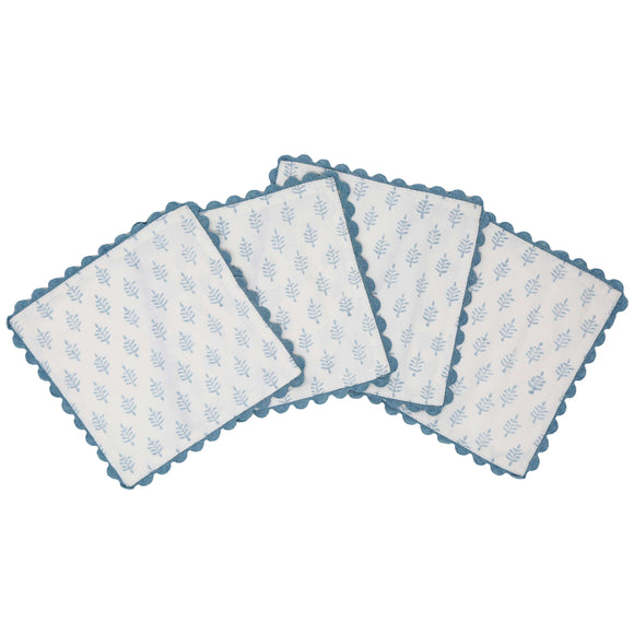White block print cocktail napkins with blue border and small trees