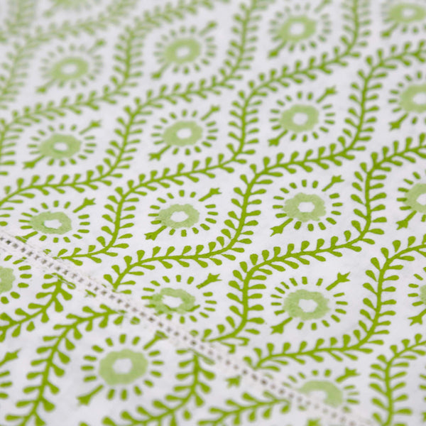 Close up of green block printed tablecloth fabric
