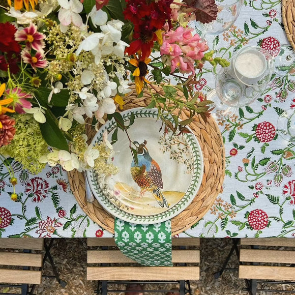Pheasant plate and flower centerpiece on block printed floral tablecloth
