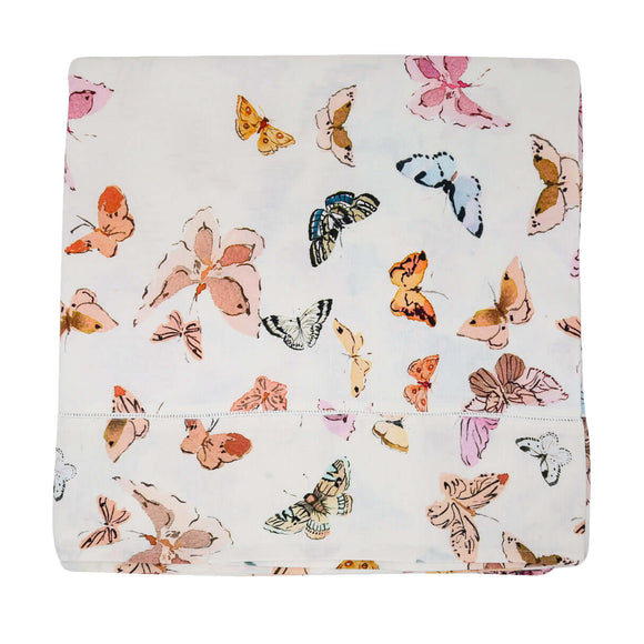 Inslee Celine Linen Tablecloth featuring watercolor butterflies on a white background for a playful table decor.