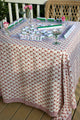 Mahjong set on red block printed floral tablecloth on front porch