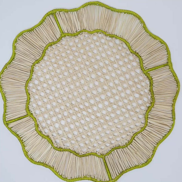 Wavy Woven Placemat, Green | These woven abaca placemats with a green border are handmade in Colombia by female artisans. These placemats add the perfect amount of texture accents to complete your table when paired with a printed tablecloth and napkins.