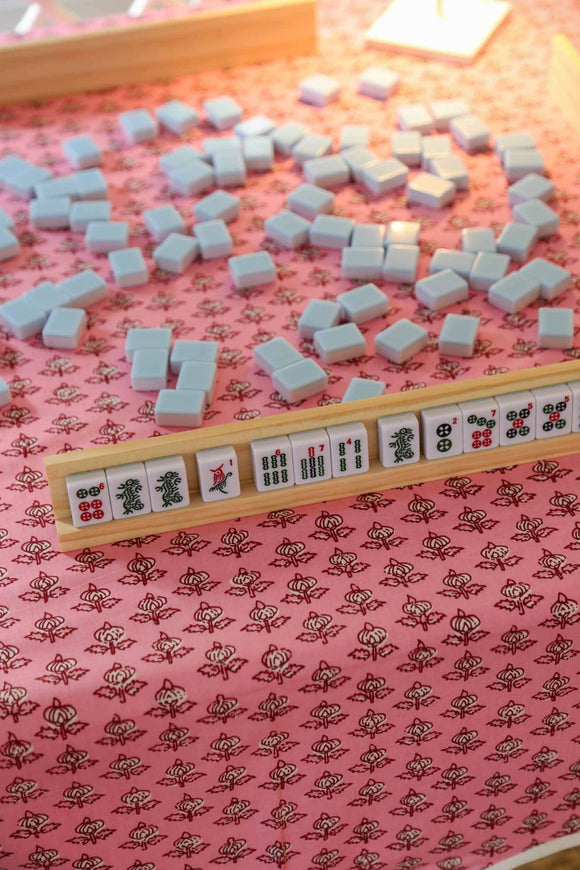 Pink block printed tablecloth with mahjong set