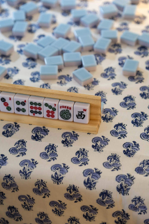 Mahjong set on blue and white block printed tablecloth