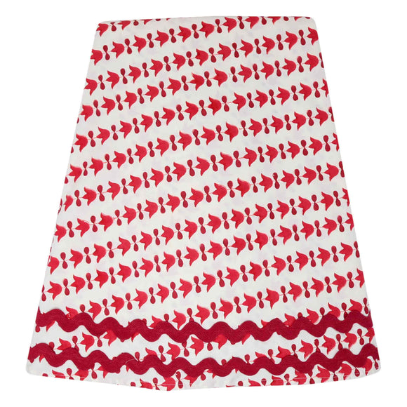 Red and white block printed round tablecloth with red ricrac trim