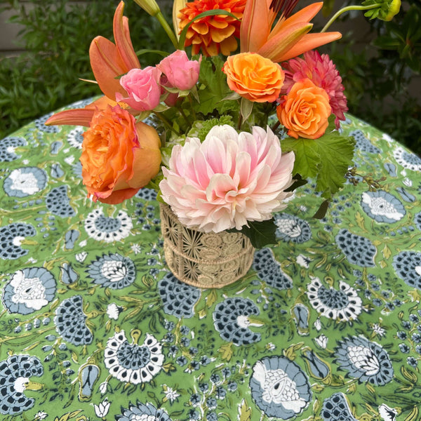 Flower bouquet on cocktail table with block printed tablecloth
