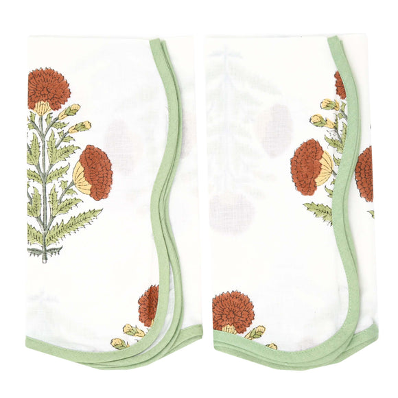 Red floral block printed napkins with green piping