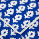 Close up of hemstitch on blue block printed napkin