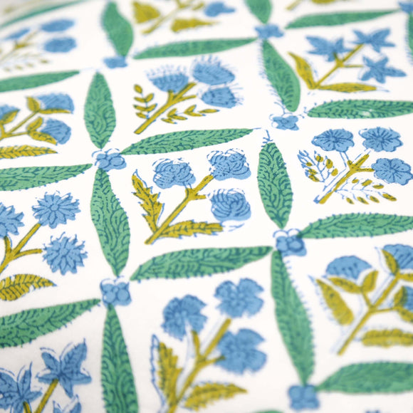 Close up of green and blue block printed pillow cover pattern