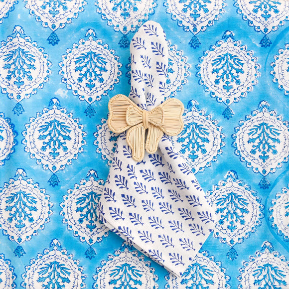 Blue block printed napkin on a blue tablecloth