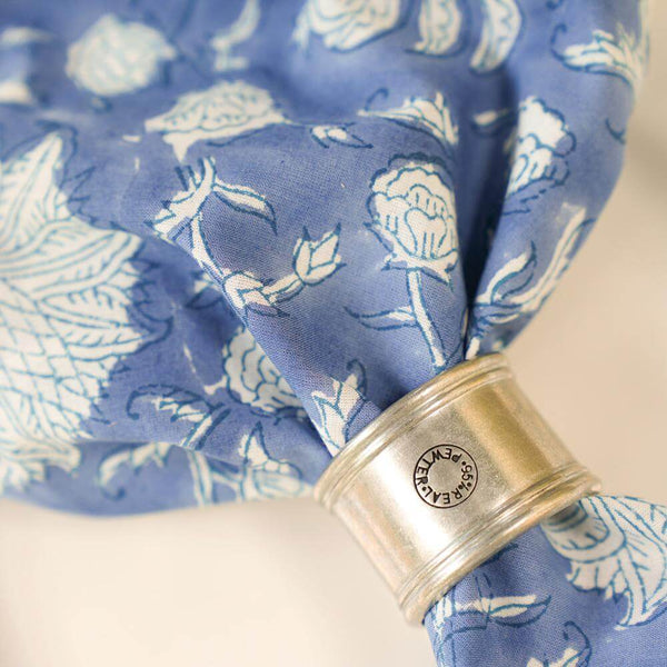 Blue and white block printed napkin with silver napkin ring