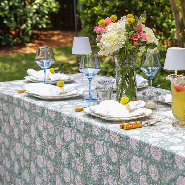 Green and white botanical outdoor table setting