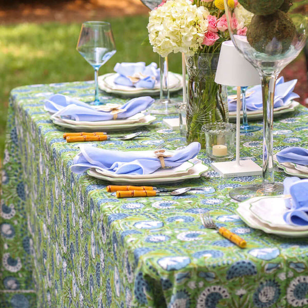 Outdoor table setting with green tablecloth