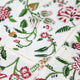 Close up of red & green floral design on napkin