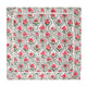 Unfolded pink and green block printed napkin