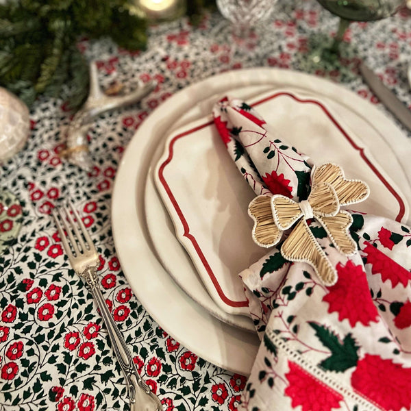 Red and white floral napkin on dinner plate