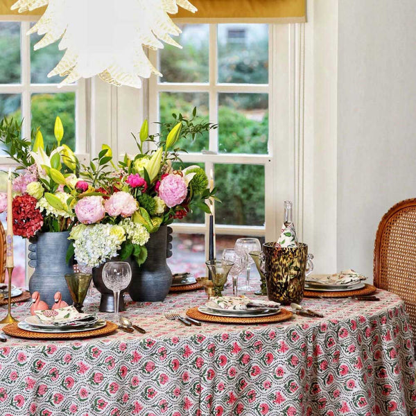 Table set with pink and green block print table cloth