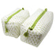 Two green and white toiletry bags