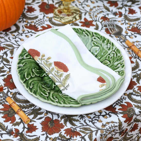 Floral block printed napkin on green plate